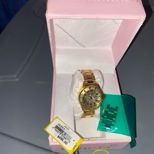 Gold watch for women. Still looks brand new in the box with original tag.